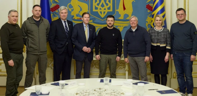 Ukraine's President Volodymyr Zelenskiy poses for a picture with U.S. Senators Lindsey Graham (R-SC), Richard Blumenthal (D-CT) and Sheldon Whitehouse