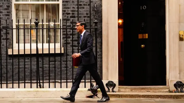 Rishi Sunak walking out of No 10 Downing Street