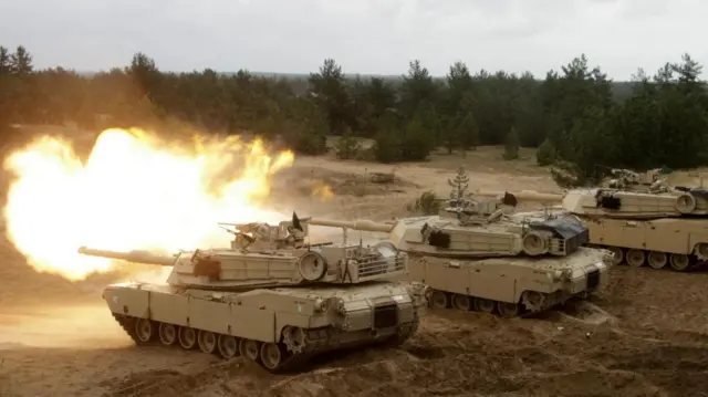 American-made Abrams tanks fire during a 2016 training exercise in Latvia