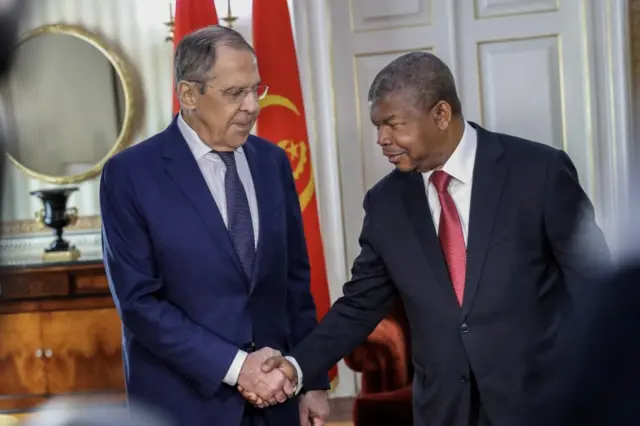 Angola's President Joao Lourenco (R) welcomes Russia's Foreign Minister Sergei Lavrov (L)