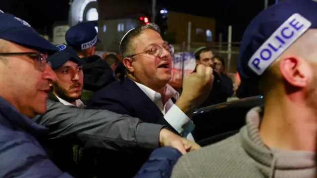 Israel's Minister of National Security Itamar Ben-Gvir meets with Israeli forces near the scene of the shooting at a synagogue in East Jerusalem