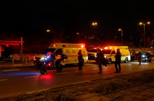 Ambulances line a street