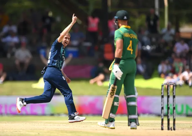 England bowler Olly Stone celebrates the wicket of Aiden Markram