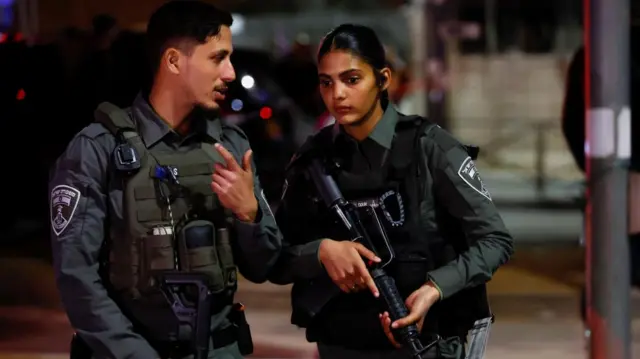 Israel security forces stand guard at the scene