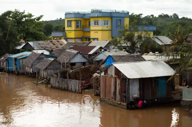 A general view of the Ambinany river in strong flood following the passage of the cyclone Cheneso near Antalaha on January 20, 2023