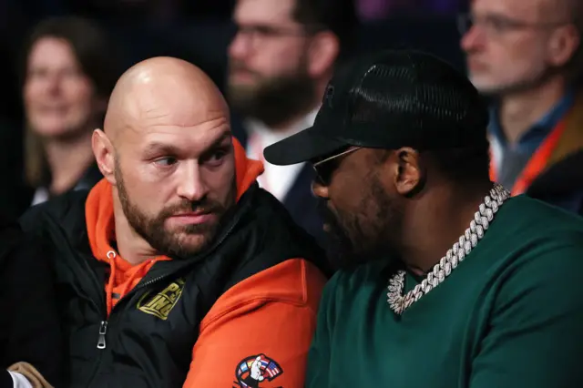 Tyson Fury speaks with Boxer Derek Chisora