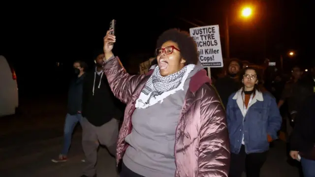 Protester hold banners at a rally in Memphis