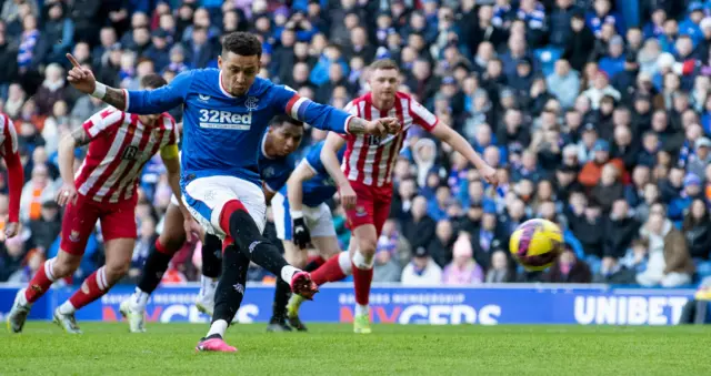 Rangers' James Tavernier scores a penalty to make it 1-0 during a cinch Premiership match between Rangers and St Johnstone at Ibrox Stadium