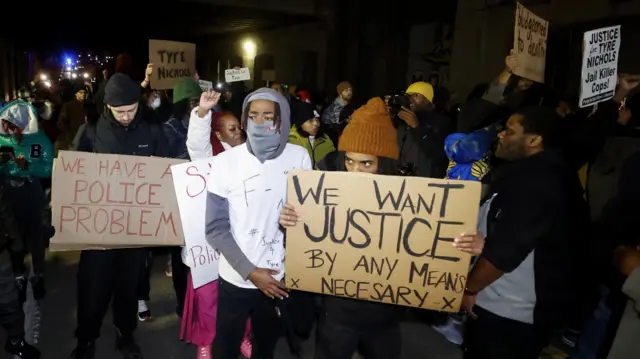 Protester hold banners at a rally in Memphis