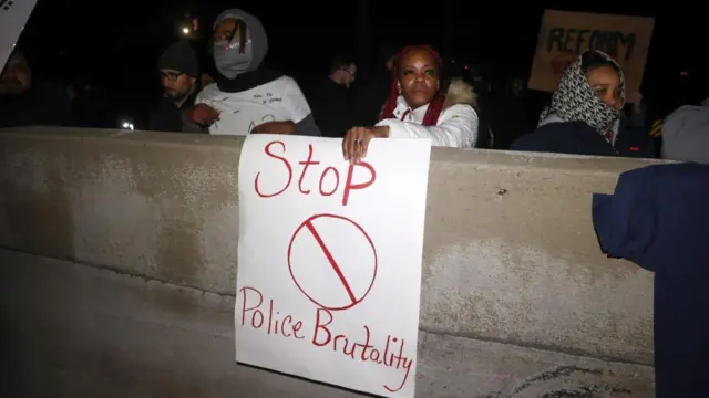 Protester hold banners at a rally in Memphis