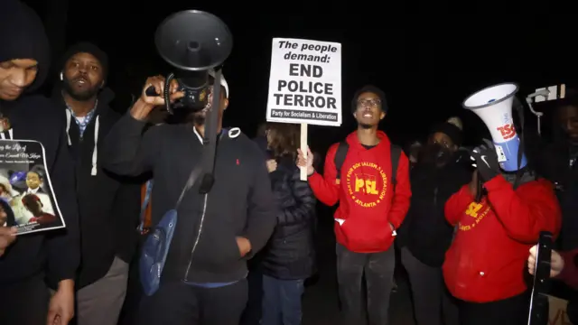 Protester hold banners at a rally in Memphis