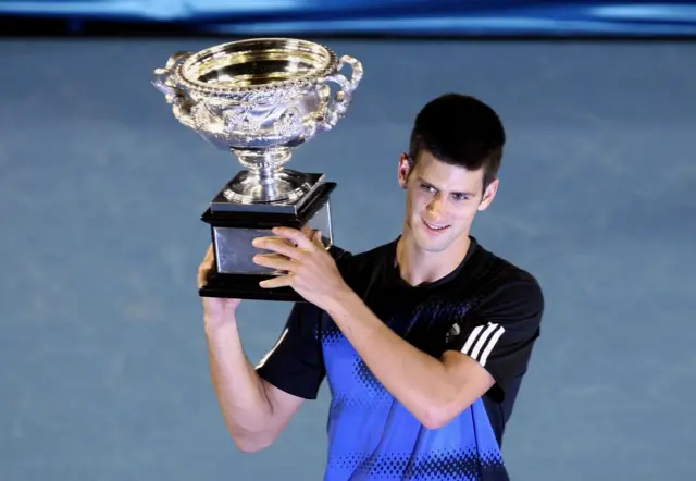 Novak Djokovic holding the Australian Open trophy in 2008