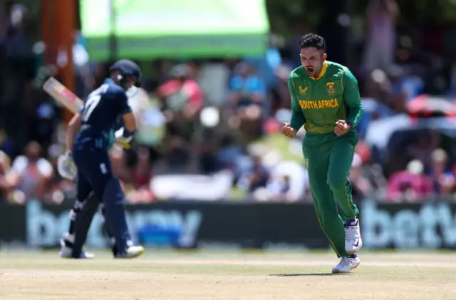 South Africa's Keshav Maharaj celebrates after taking the wicket of England's Ben Duckett