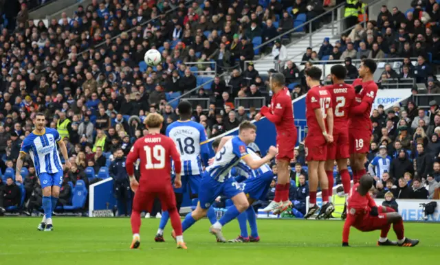 Lewis Dunk takes a free kick for Brighton