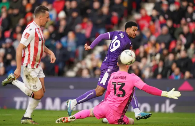 Stevenage's Jamie Reid scores against Stoke