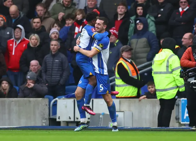 Lewis Dunk and Tariq Lamptey celebrate Brighton's goal