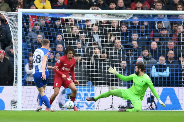 Evan Ferguson of Brighton & Hove Albion has a shot blocked by Trent Alexander-Arnold