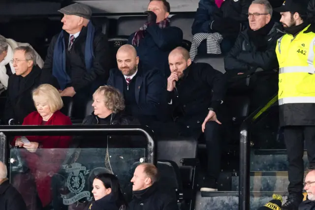 Robbie Neilson serves the second of his three match ban from the touchline