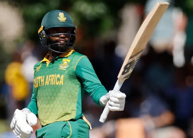 South Africa's Temba Bavuma celebrates after scoring a half-century (50 runs) during the second one day international (ODI) cricket match between South Africa and England at Mangaung Oval in Bloemfontein