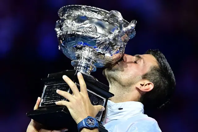 Novak Djokovic kisses the trophy