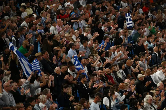 Fans waving Greek flags