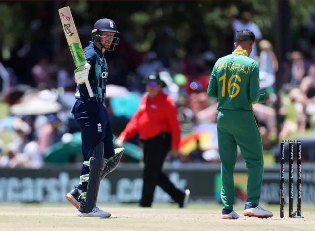 Jos Buttler celebrates his half-century