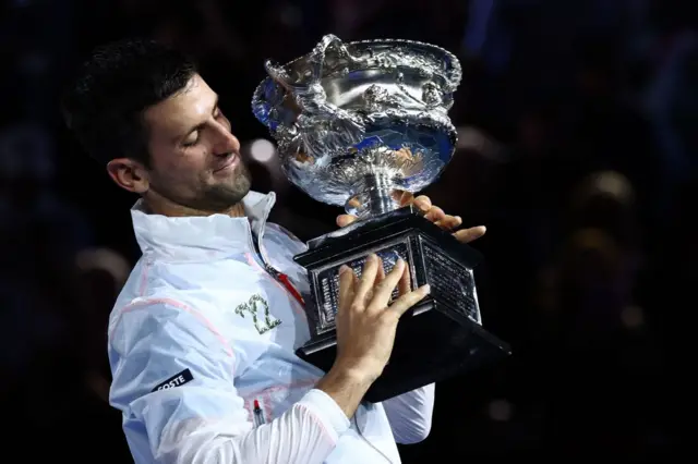 Djokovic holding the trophy