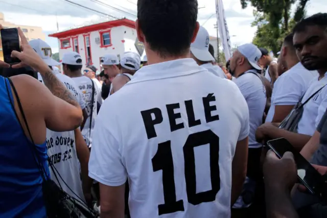 Fans wear Pele shirts