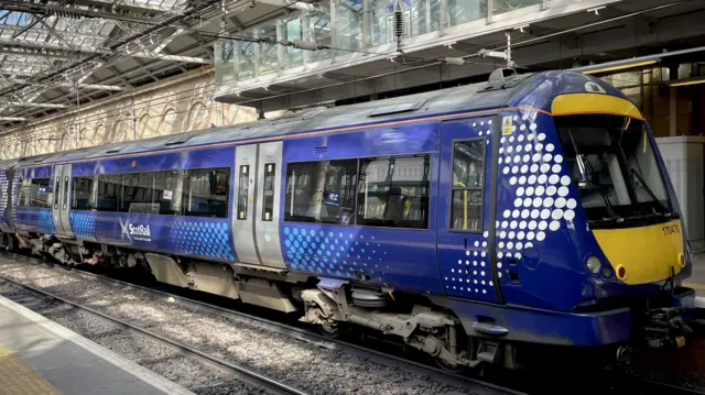 A ScotRail train sits on the tracks at Edinburgh's Waverley Station