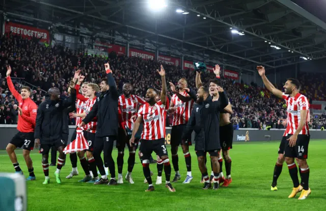 Brentford players celebrating their win over Liverpool