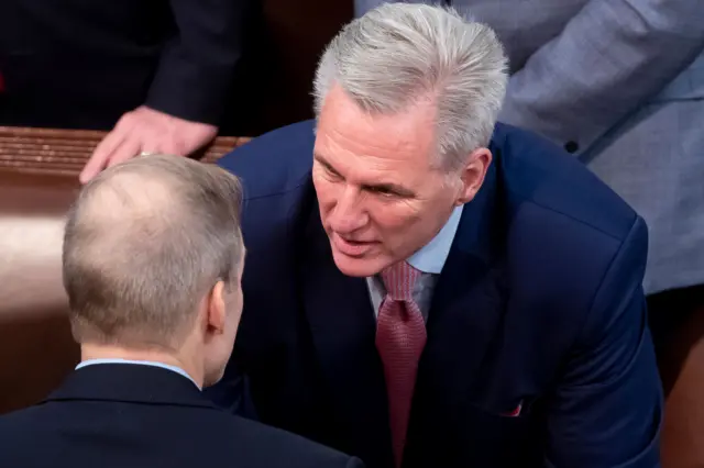 Republican Representative of California Kevin McCarthy (R) speaks to Republican Representative of Ohio Jim Jordan (L)