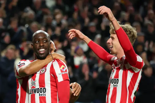 Brentford celebrate scoring against Liverpool