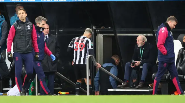 Bruno Guimaraes leaves the field after being sent off