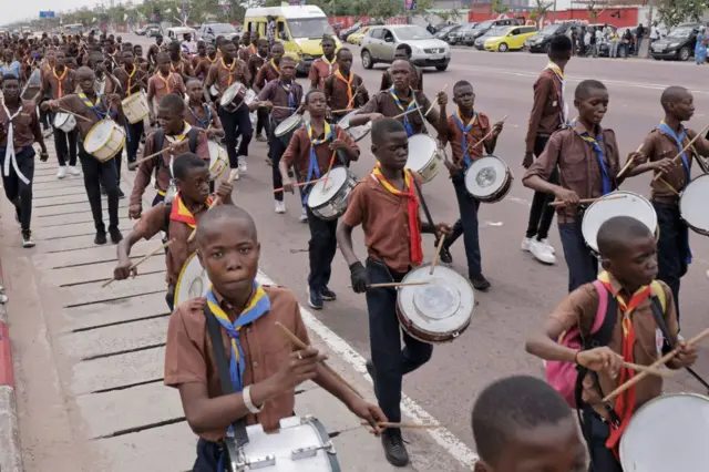 Children play in a marching band.