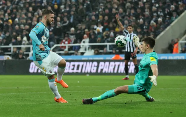 Nick Pope saves Adam Armstrong's shot