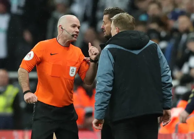 Referee Paul Tierney with Newcastle United manager Eddie Howe