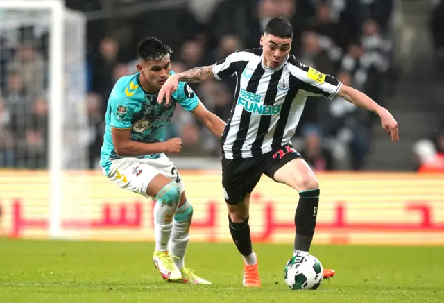 Southampton's Carlos Alcaraz and Newcastle United's Miguel Almiron battle for the ball