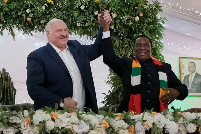 President Alexander Lukashenko and President Emmerson Mnangagwa celebrate signing the deal.