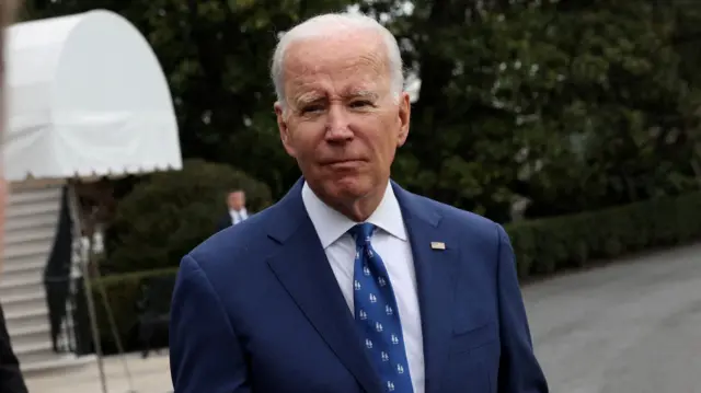 President Joe Biden speaks to the news media before boarding Marine One for travel to Kentucky from the South Lawn of the White House