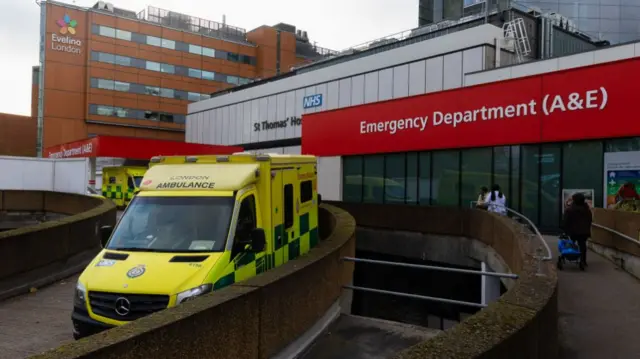 Ambulances belonging to the London Ambulance Service are parked at St. Thomas' Hospital