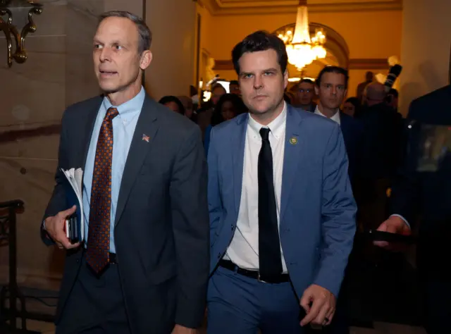 Florida's Matt Gaetz (left) departs the chamber with Pennsylvania's Scott Perry