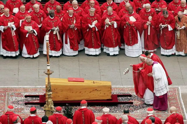 Incense is cast over the coffin of Pope John Paul II by German Cardinal Joseph Ratzinger during the funeral mass in St. Peter's Square on April 8, 2005 in Vatican City