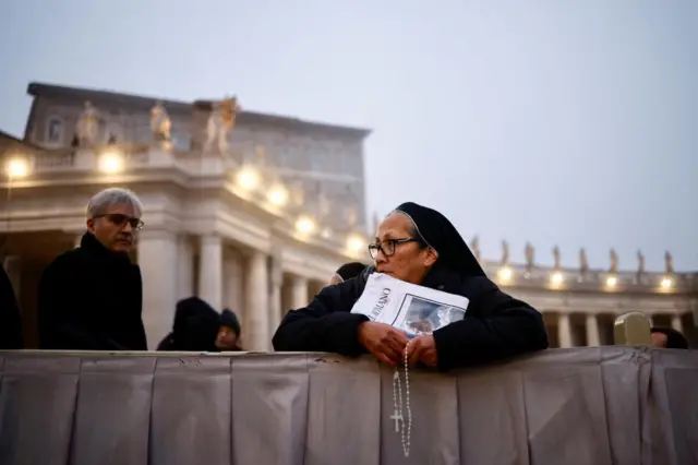 Mourners gather in the Vatican