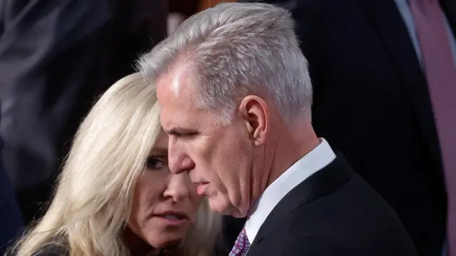 Kevin McCarthy speaking with Marjorie Taylor Greene.