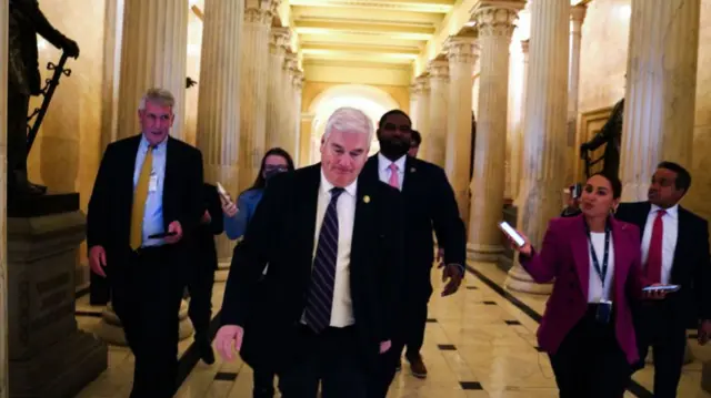 Tom Emmer walking through corridor