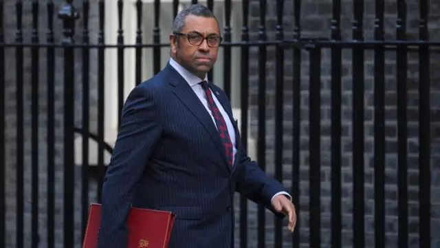 Foreign Secretary James Cleverly walks outside Number 10 Downing Street