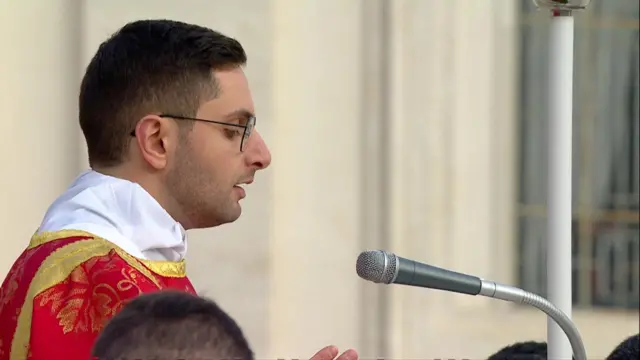 A cleric reads the Responsorial Psalm in Latin.