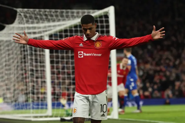 Manchester United's Marcus Rashford celebrates Everton's Conor Coady turning his cross into the net for an own goal