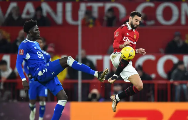 Manchester United's Bruno Fernandes (R) in action during the FA Cup third round match between Manchester United and Everton in Manchester