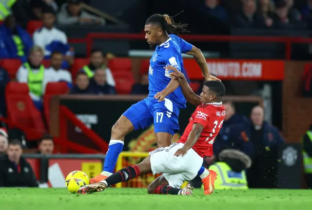 Everton's Alex Iwobi in action with Manchester United's Tyrell Malacia